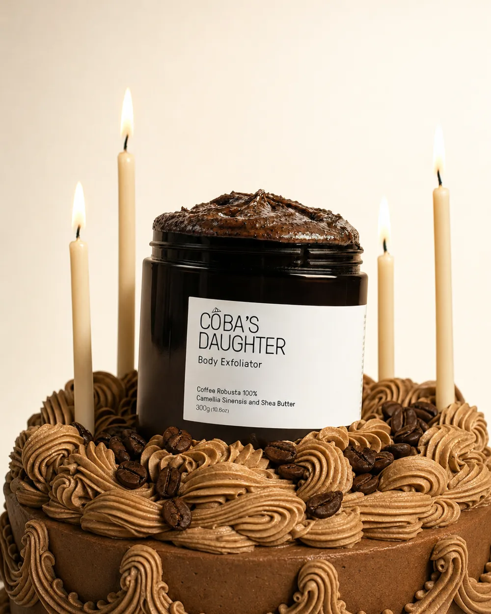 CoBa’s Daughter Robusta coffee scrub set into a mocha birthday cake with lit candles