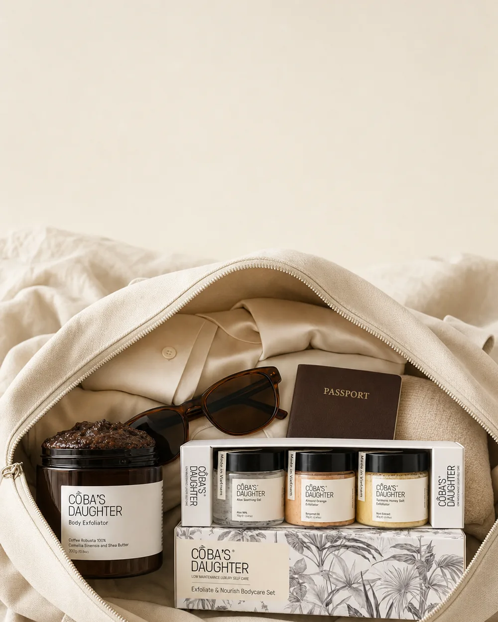 Open cream weekender bag packed with the CoBa’s Daughter travel set and Robusta coffee scrub