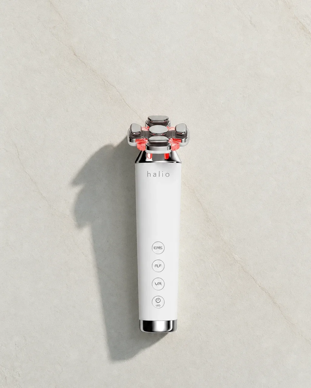 Halio RevitaWave Skin Rejuvenator, top wordmark headline flatlay full bleed