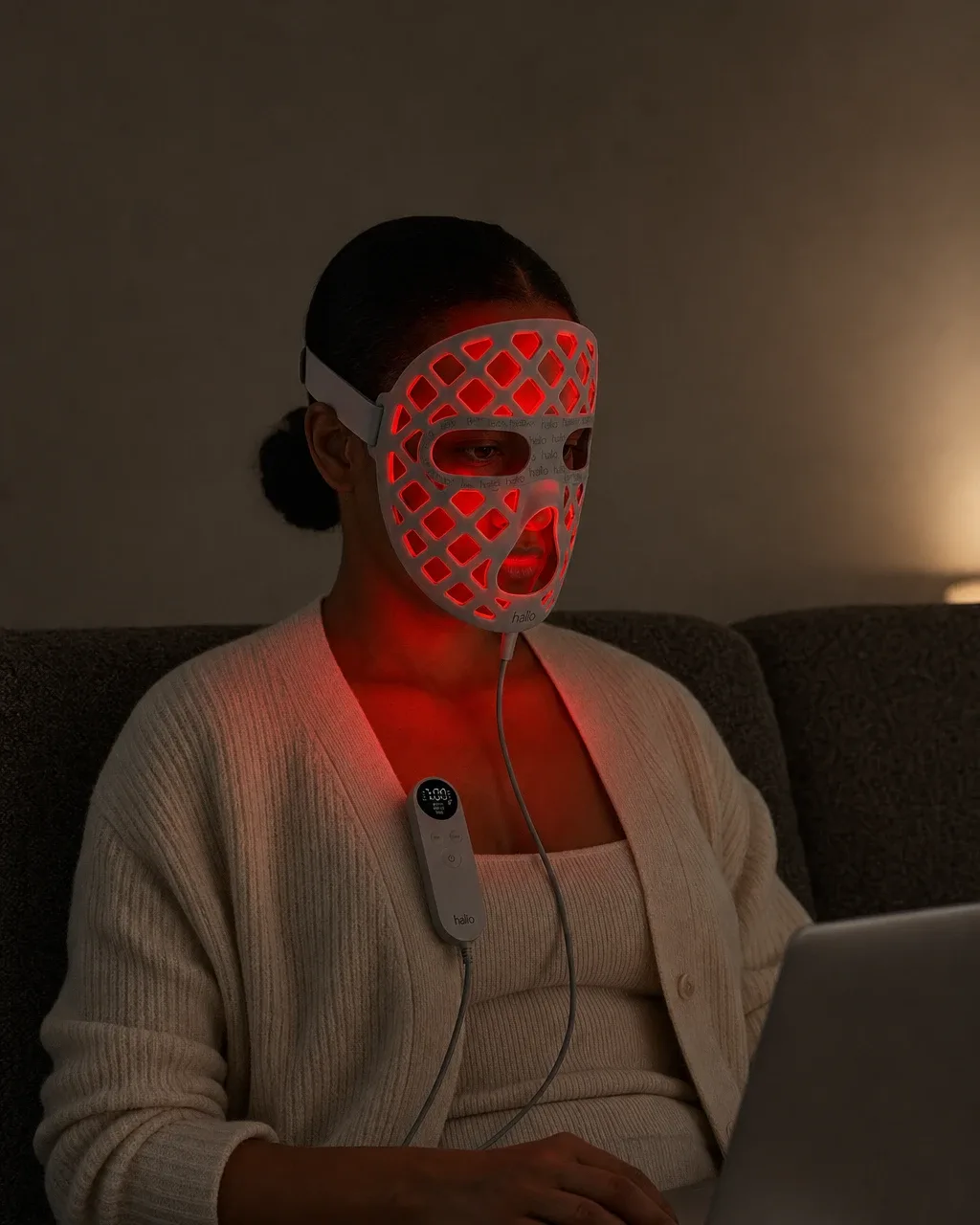 Halio PureGlow Ultralite Silicone LED Face Mask Pro, italic asterisk caption dark couch glow