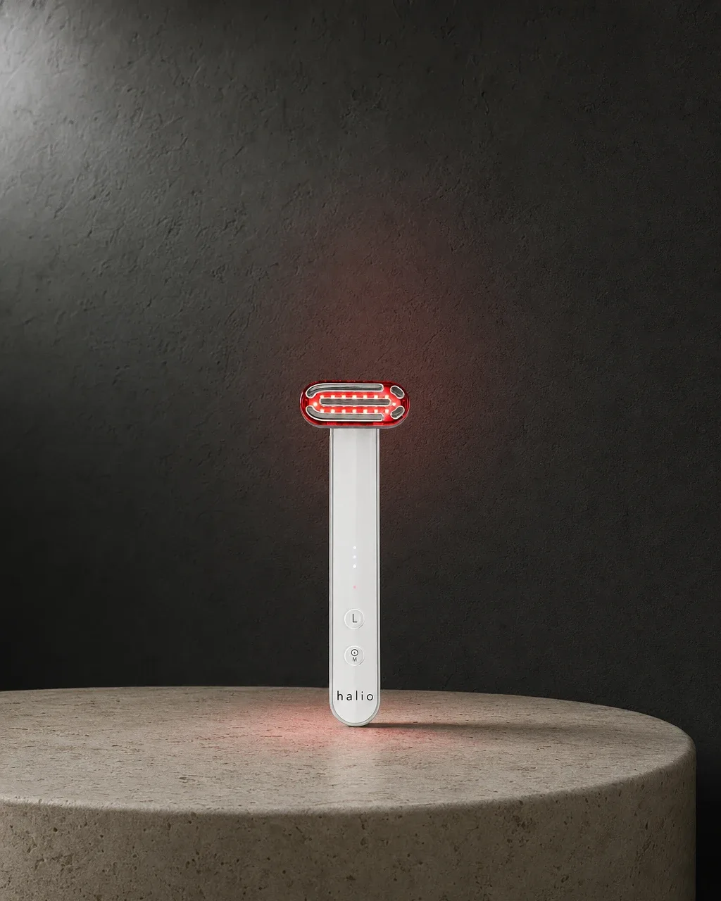 Halio Red Light Therapy Device, dark alcove kicker caps headline glowing upright