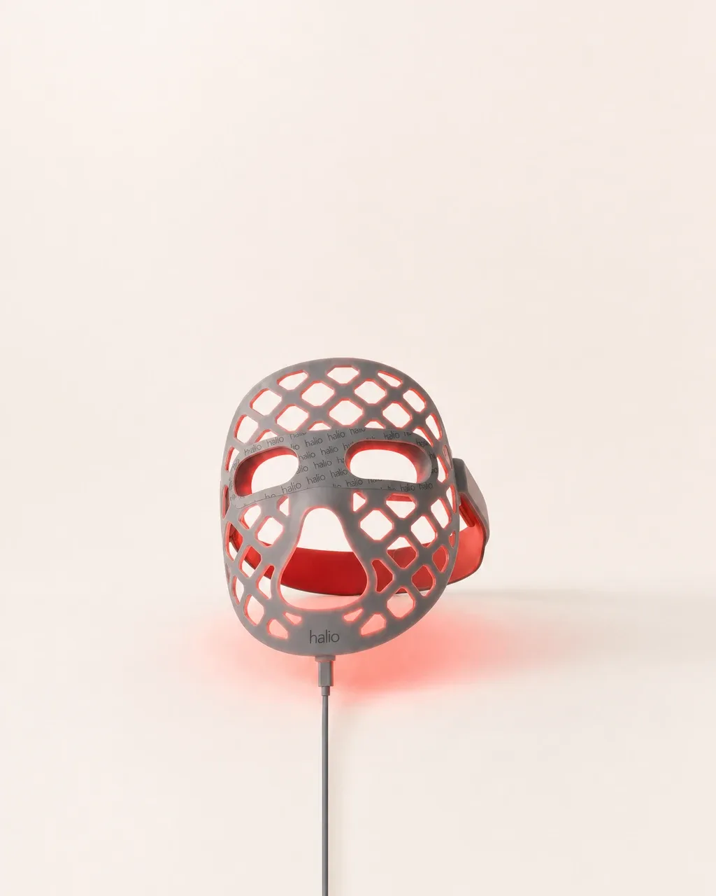 Halio PureGlow Ultralite Silicone LED Face Mask Pro, pale field standing glowing device single line