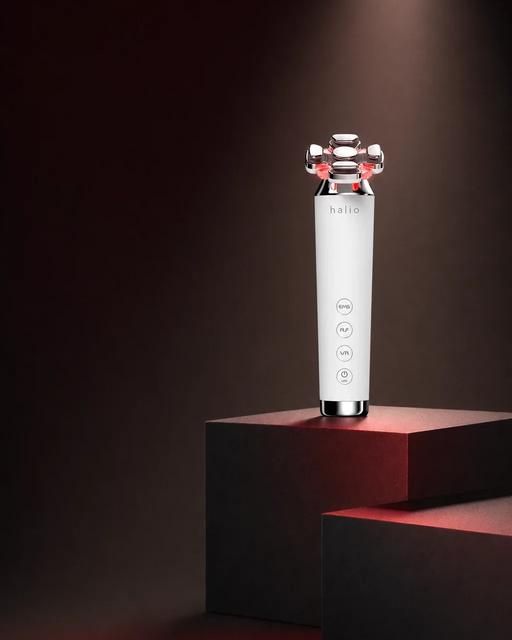 Halio RevitaWave Skin Rejuvenator, spotlit dark plinth stack left headline subline