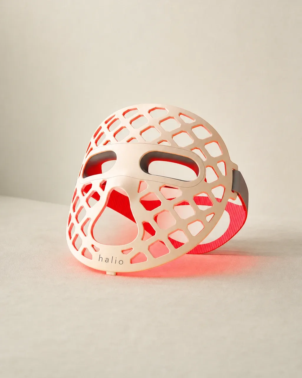 Halio PureGlow Ultralite Silicone LED Face Mask, pale field standing glowing mask three quarter l